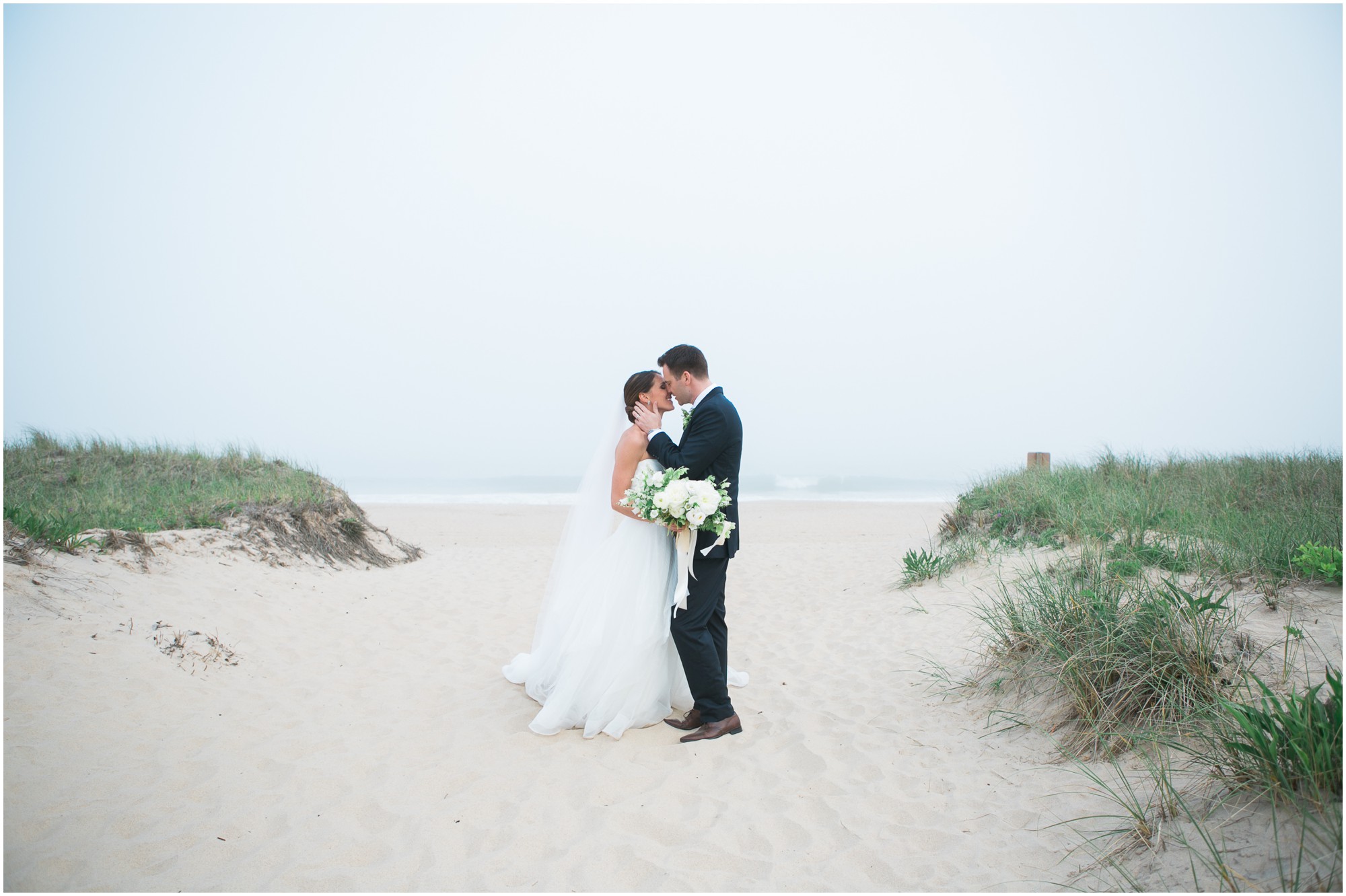 A bride and groom on the beach in the hamptons